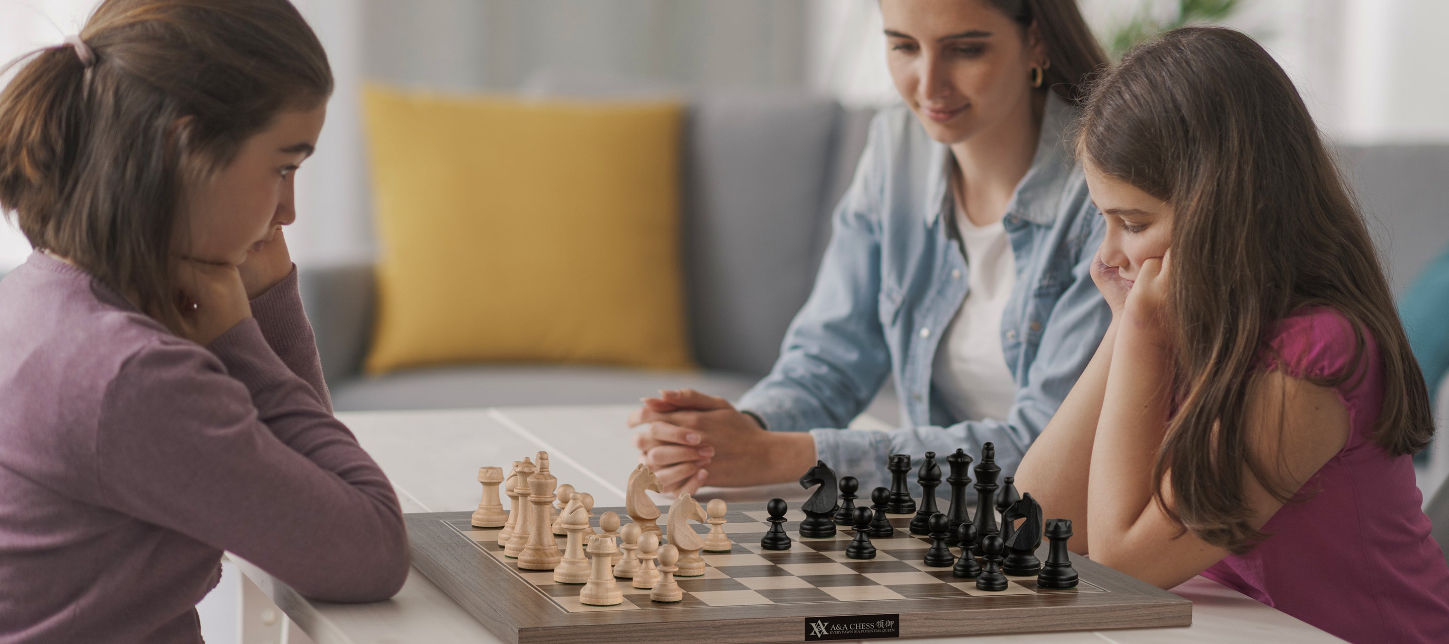 Several sisters are playing chess together.
