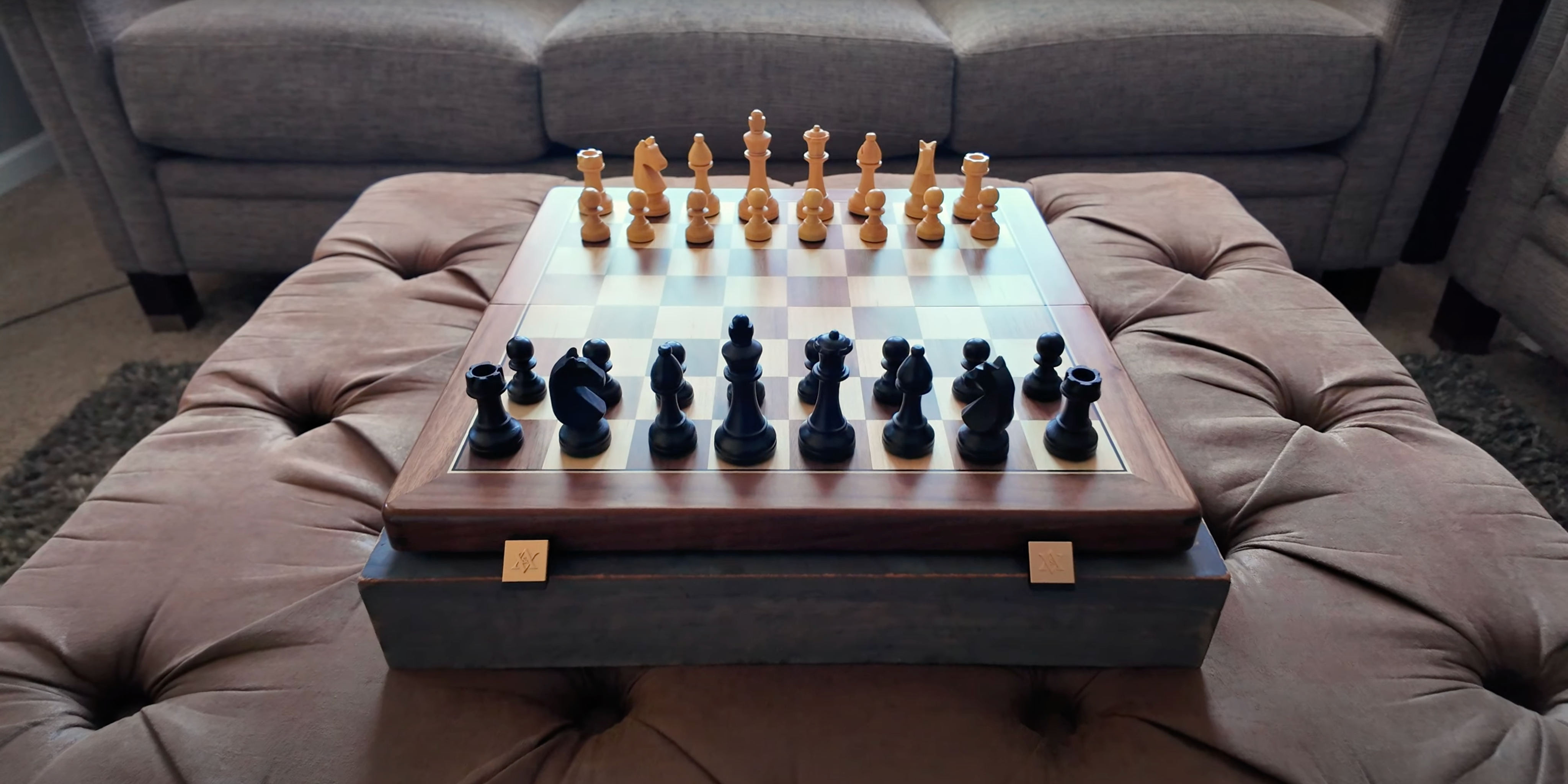 A walnut wood chess set placed on the sofa.